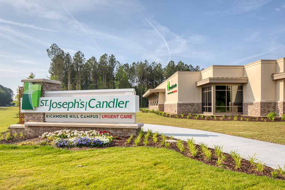 The entrance sign and modern single-story buildings of the St. Joseph's/Candler Richmond Hill Campus at Heartwood, 3866 Belfast Keller Road.